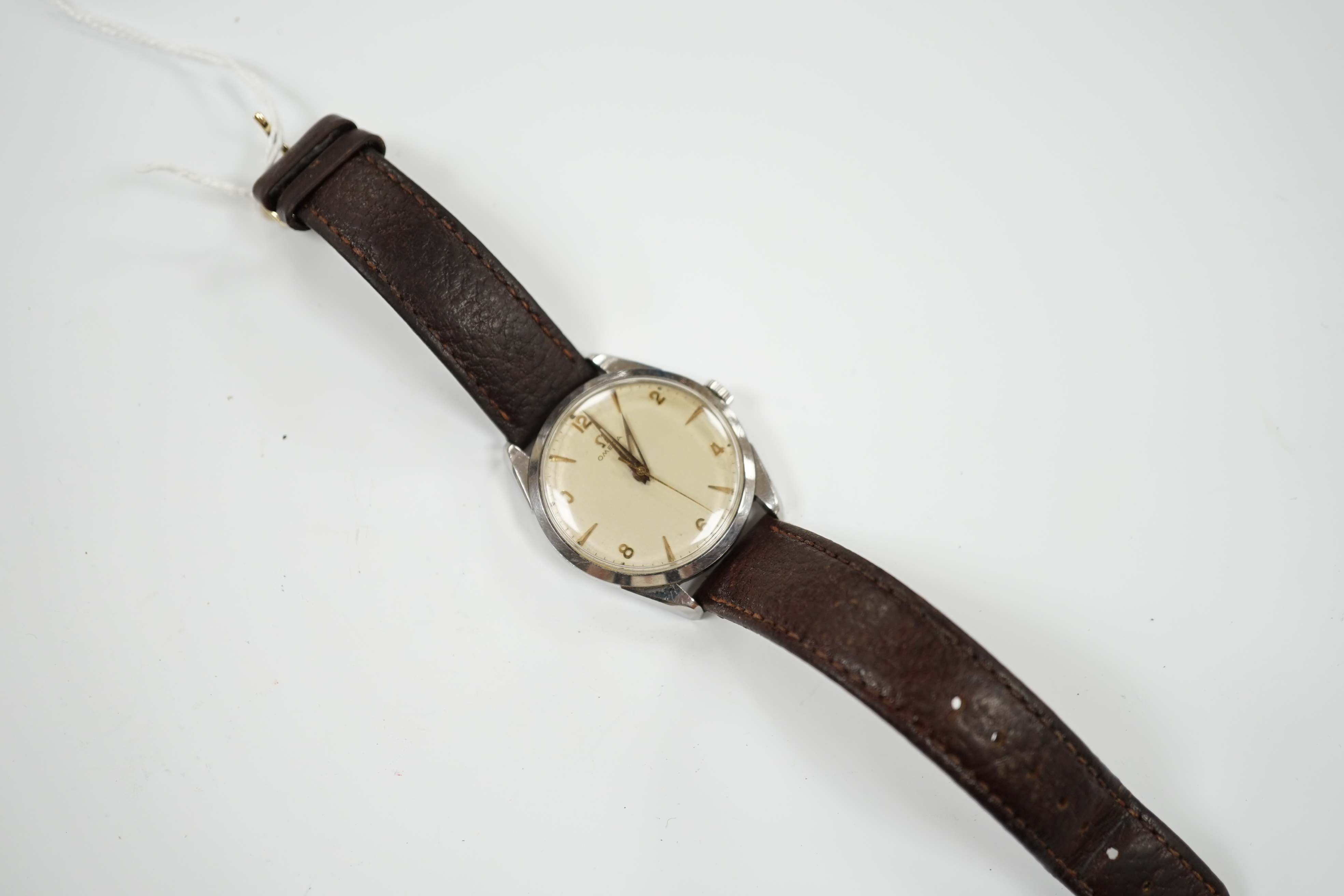 A gentleman's late 1950's stainless steel Omega manual wind wrist watch, with baton and Arabic numerals, movement c.284, on associated strap, case diameter 35mm.